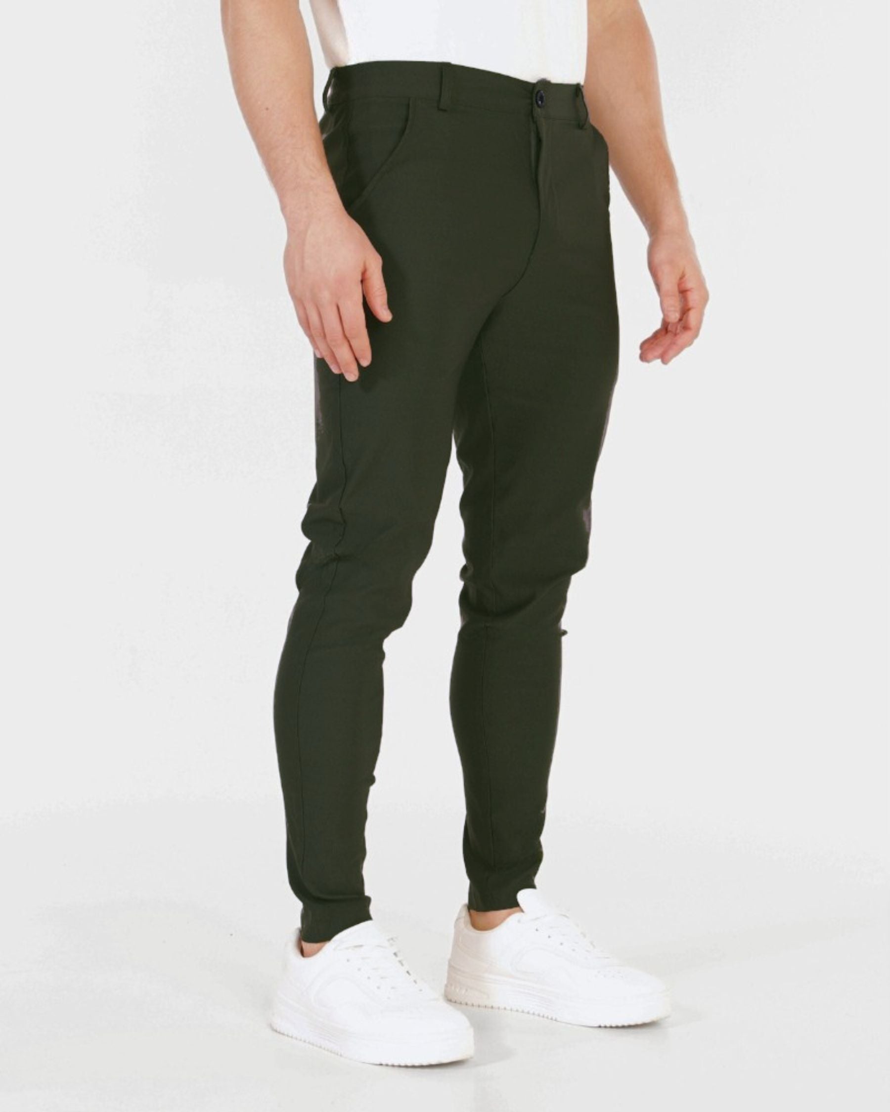Brown pants worn by a person on a white background