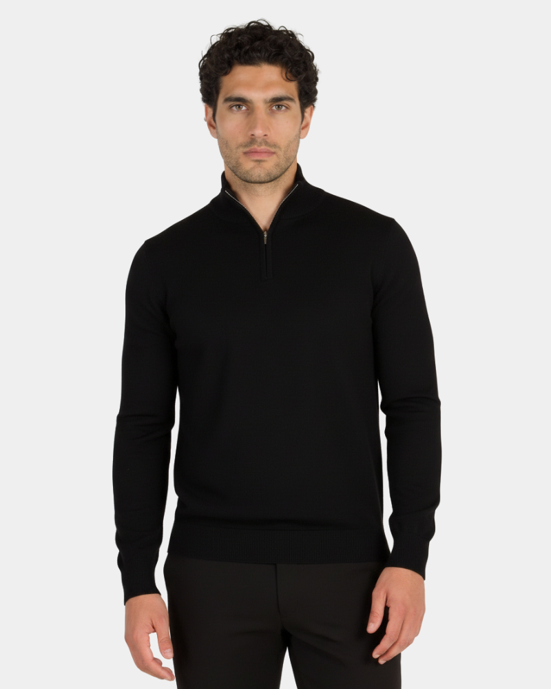 Minimalist luxury black knit half-zip sweater in a premium fine-gauge wool blend. Tailored fit with ribbed cuffs and collar.