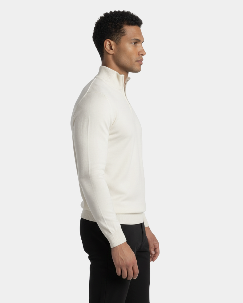 Minimalist luxury cream wool knit sweater featuring a slim fit, ribbed collar, and half-zip detail for a timeless look.