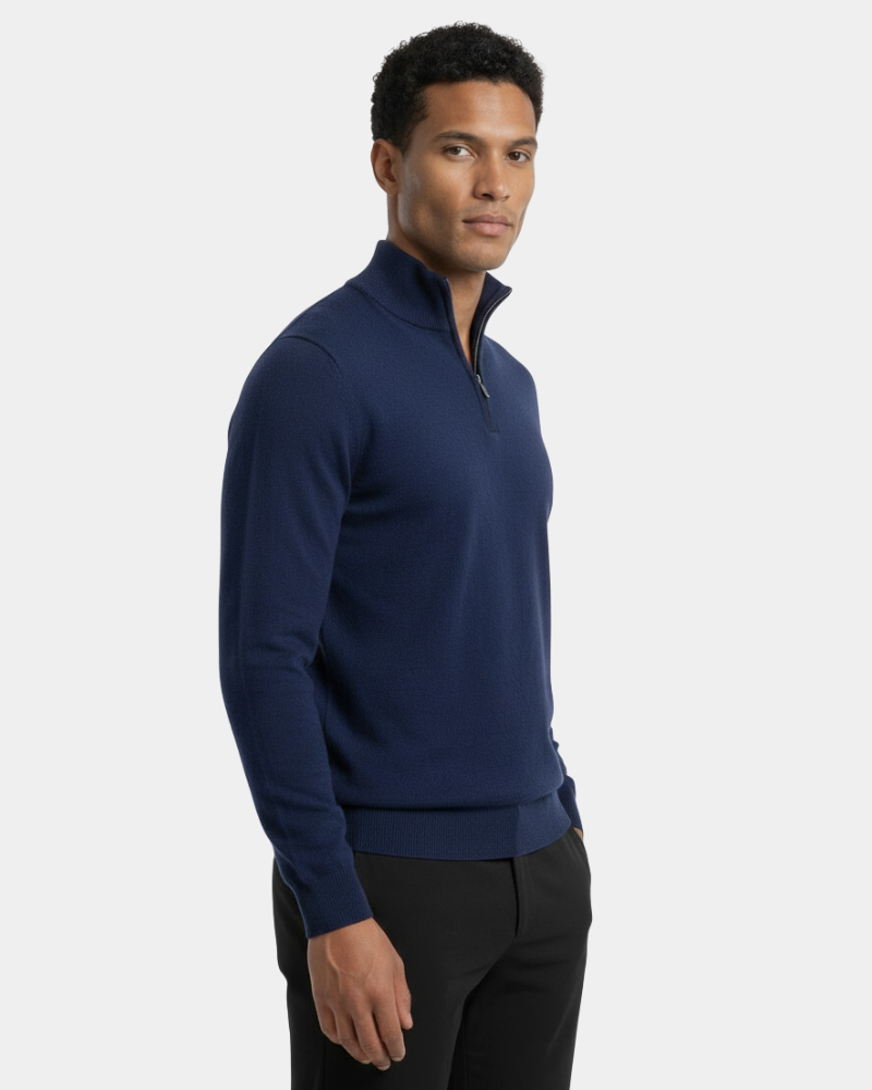 Side profile of a luxury navy knit sweater showcasing a slim silhouette, ribbed cuffs, and fine minimalist texture.