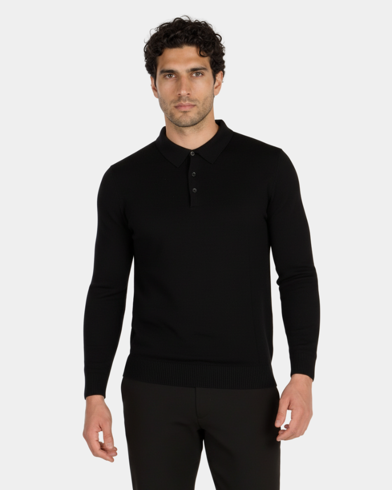 Minimalist luxury black knit polo in fine-gauge wool. Slim fit with ribbed cuffs and three-button collar.