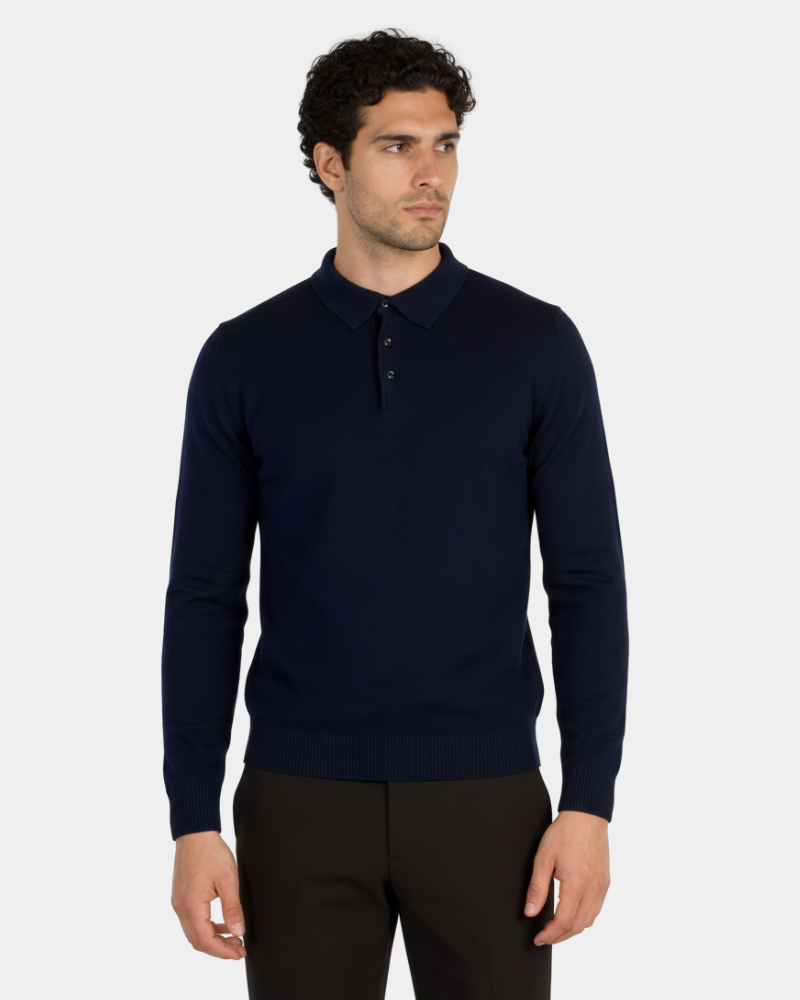 Minimalist luxury navy knit polo in fine-gauge merino wool. Slim fit with a structured collar and ribbed cuffs.