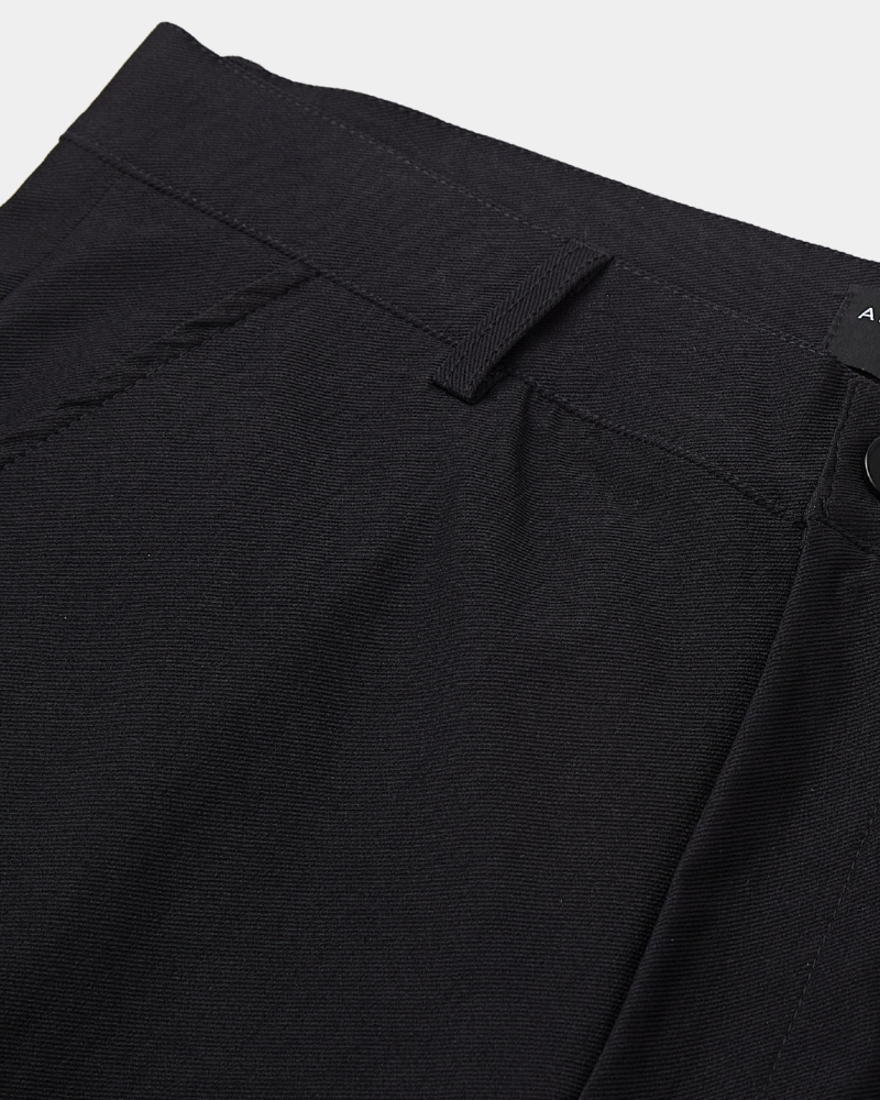 By Alden Close-up of luxury black stretch cotton fabric, highlighting the minimalist waistband and premium texture. #color_black