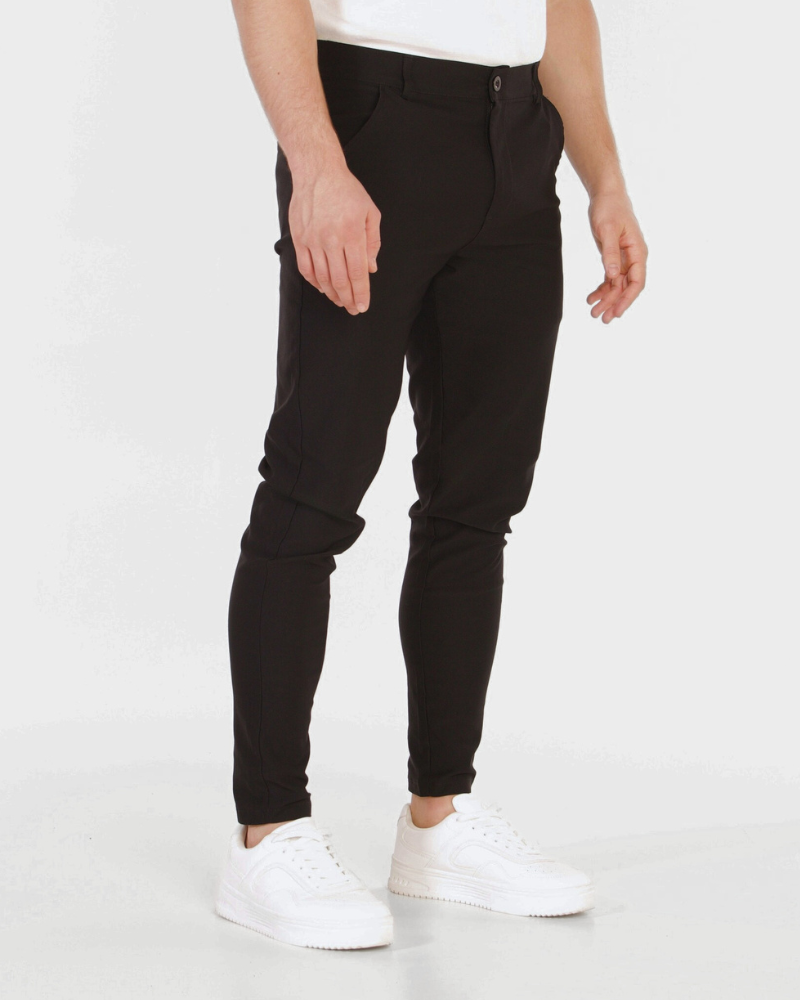 Minimalist luxury black stretch cotton chinos in a slim fit, showcasing a premium, tailored silhouette.