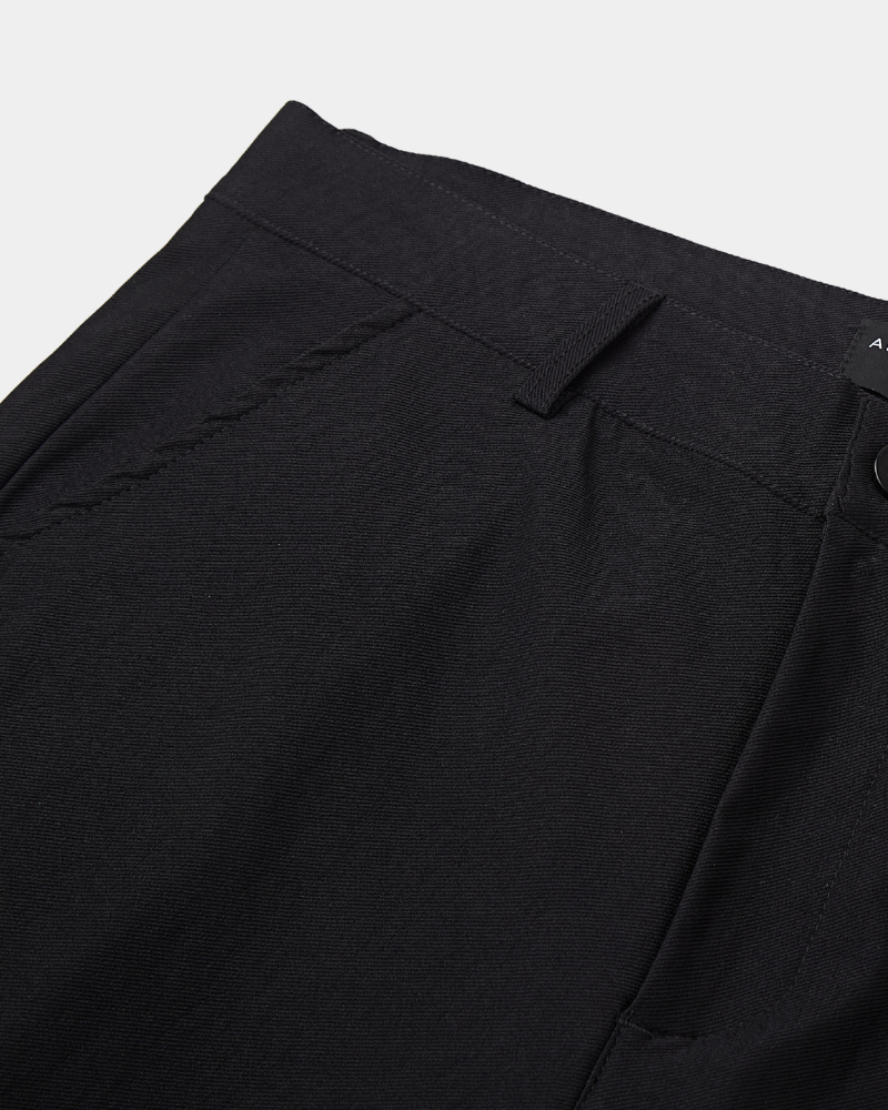 Detailed view of luxury black stretch cotton fabric, emphasizing the fine weave and high-quality minimalist finish.