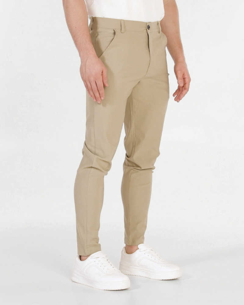 Minimalist luxury khaki chinos in premium stretch cotton twill, featuring a sleek slim fit and tapered leg.