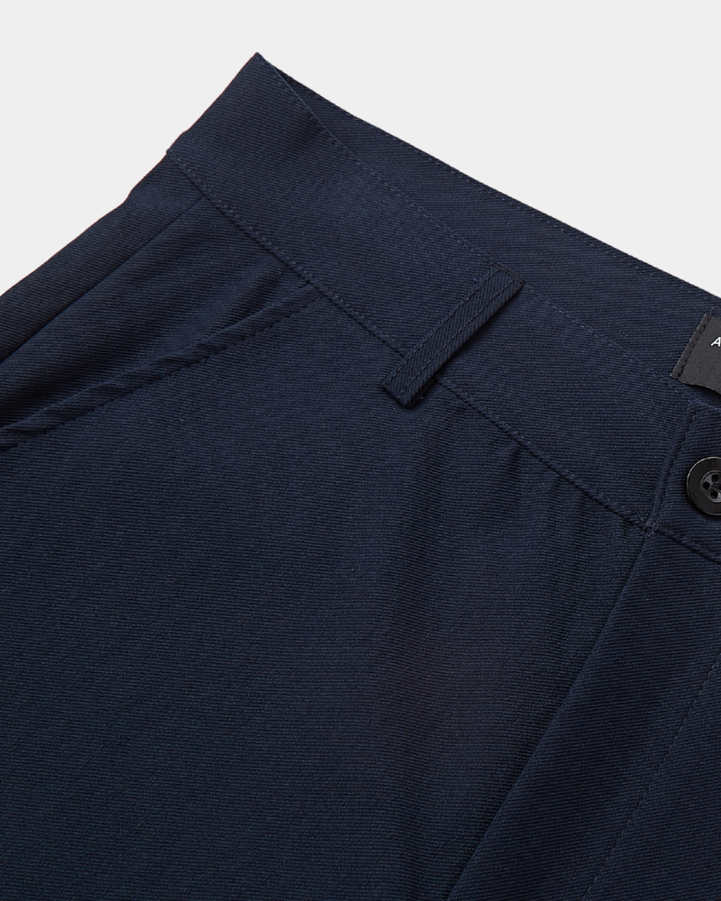 Close-up of By Alden minimalist luxury navy chinos in a breathable twill cotton-stretch fabric with a clean-tailored waistband. #color_navy