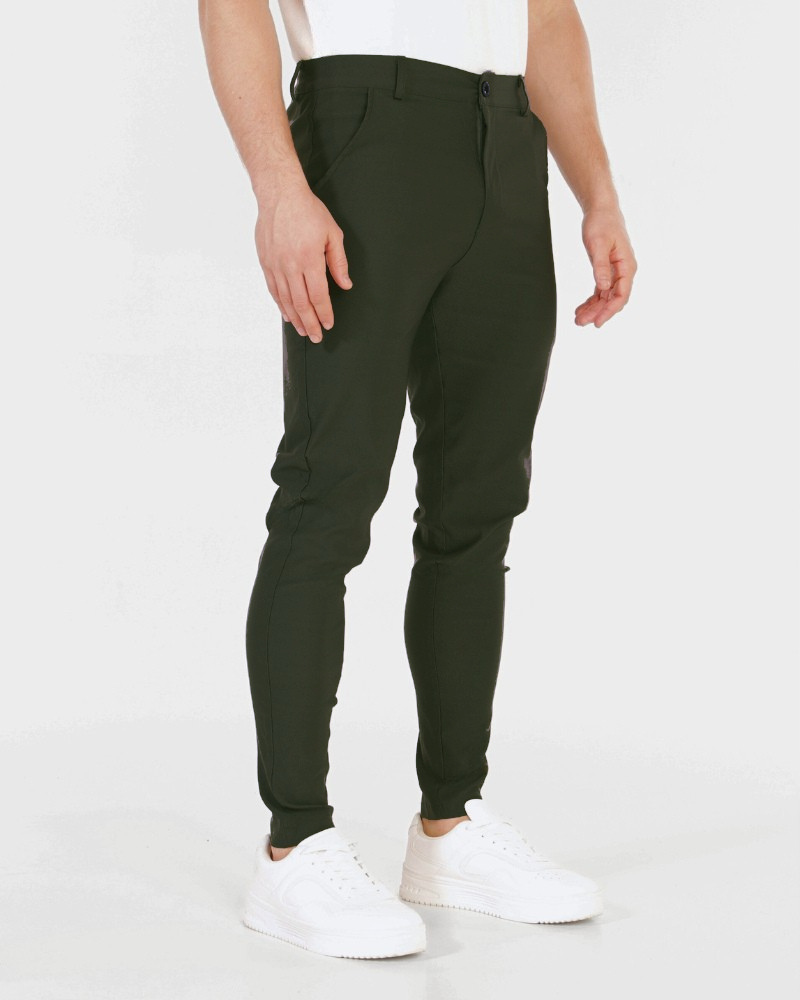 Minimalist luxury olive chinos in a slim-fit technical stretch fabric with a smooth matte texture.