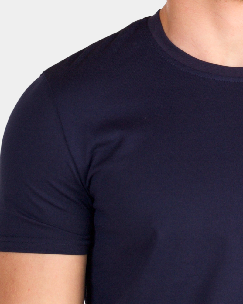 Luxury minimalist navy pima cotton Smart Fit T-shirt detail showing the premium fine-knit texture and soft sheen.