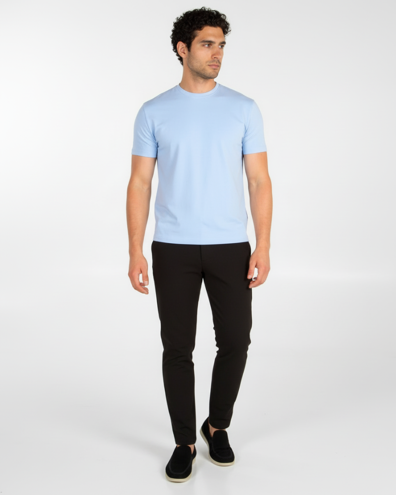 Full-length view of model in a luxury sky blue Smart Fit T-shirt, styled for a timeless, minimal aesthetic.
