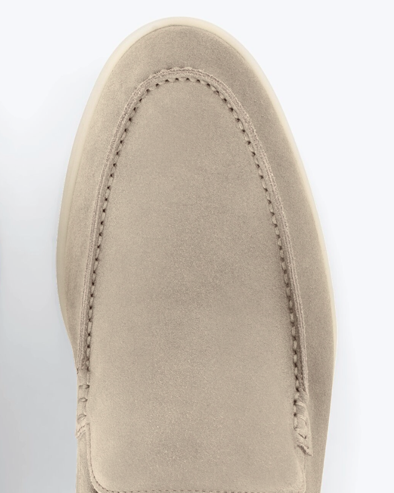 Close-up of By Alden luxury beige suede loafers showing fine texture, tonal minimalist stitching, and a premium almond-toe fit. #color_deep stone