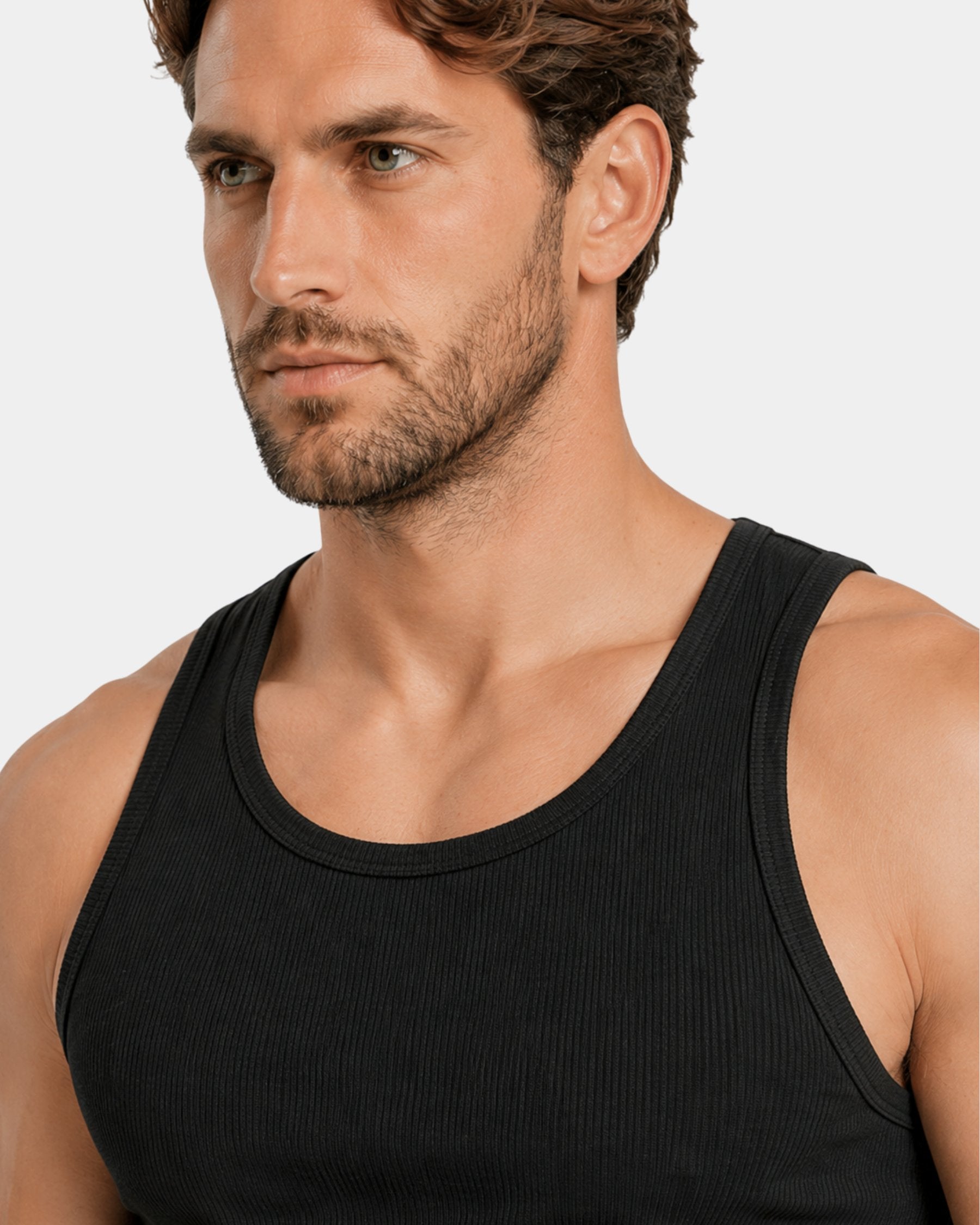 By Alden black ribbed tank top on male model, close-up detail of neckline and shoulder, light gray background #Color_black