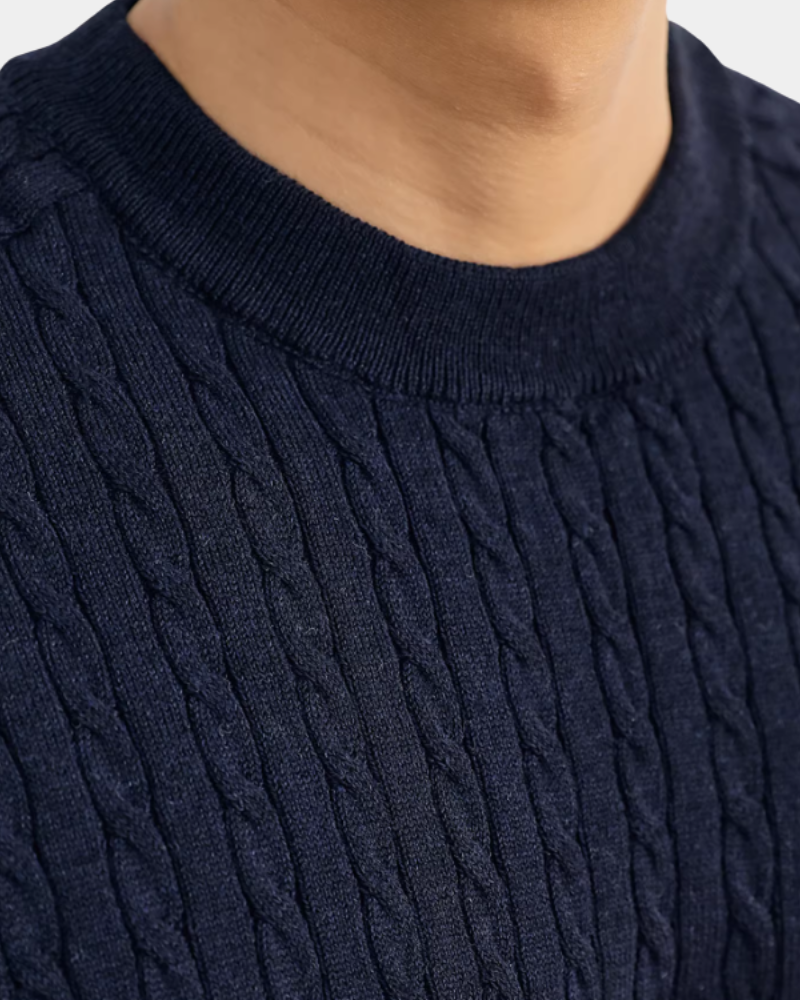 Close-up of a By Alden navy blue cable knit sweater #color_navy
