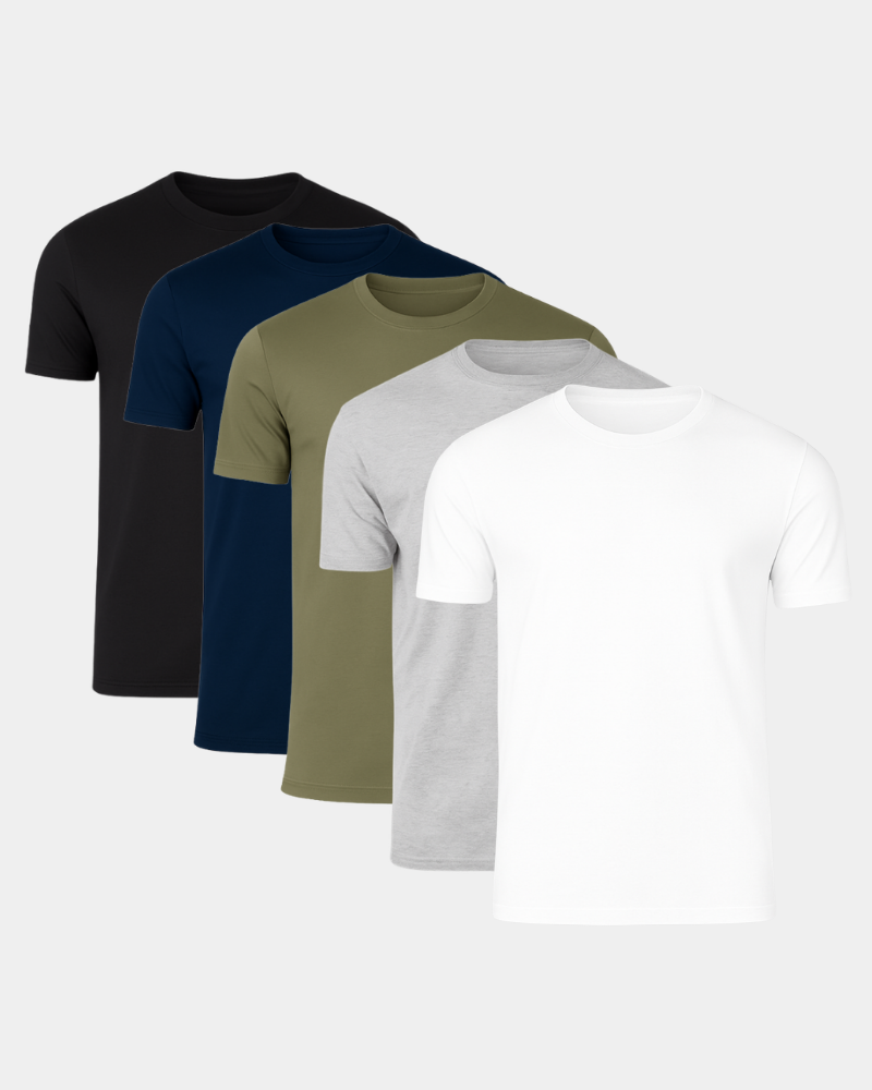 Four plain t-shirts in black, navy, green, and white on a light gray background #Color_mixed basics