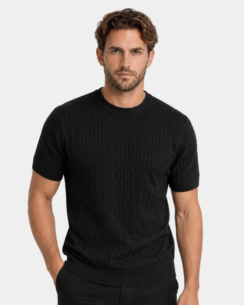 Man wearing a By Alden black ribbed knit t-shirt against a plain background #color_black