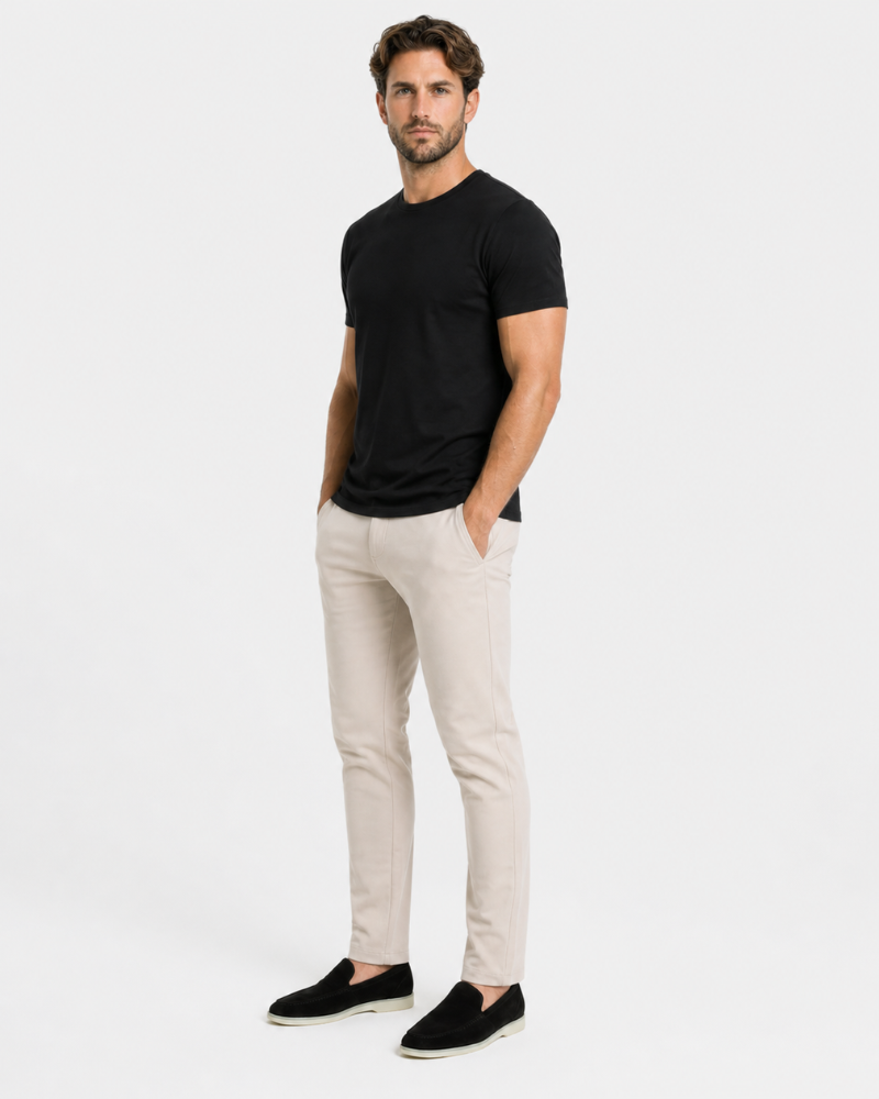 Man wearing a By Alden black t-shirt and beige pants on a white background #Color_beige
