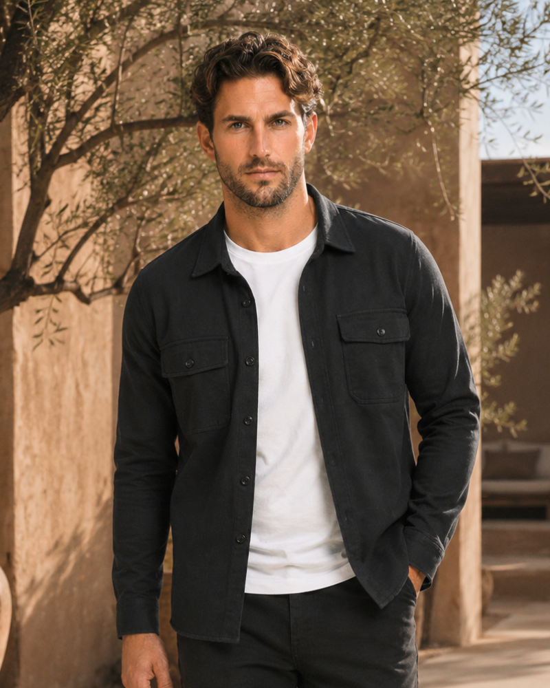 By Alden black overshirt on male model, front view, upper body, outdoor warm beige background. #Color_black