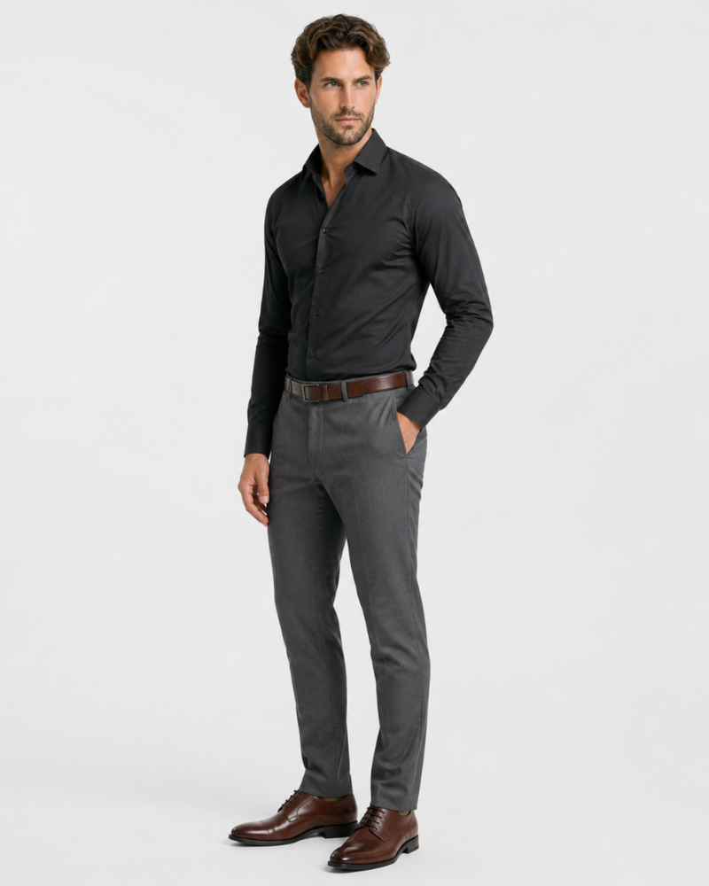 By Alden black slim-fit dress shirt on male model, three-quarter view, full body, light gray background. #color_black