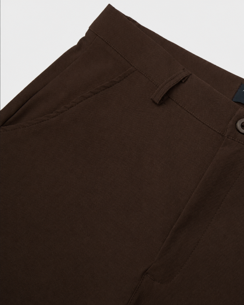 By Alden brown chino trousers waistband and pocket detail, flat lay, close-up, light gray background. #color_dark brown