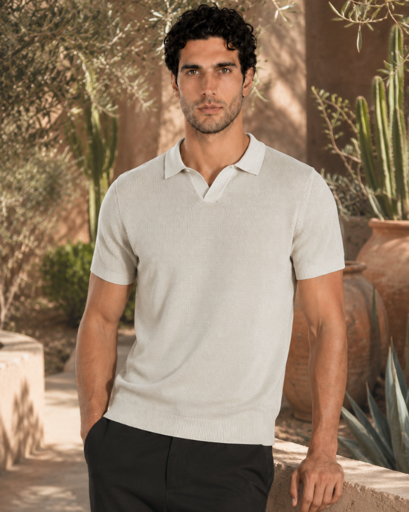 By Alden cream open-collar knit polo shirt on male model, front view, upper body, outdoor warm beige background. #color_off white