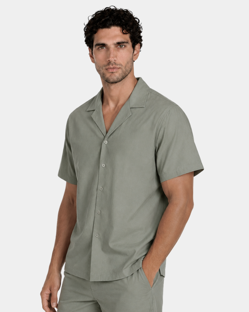 By Alden olive green short-sleeve shirt on male Caucasian model, 3/4 angle, gray bg #Color_olive green