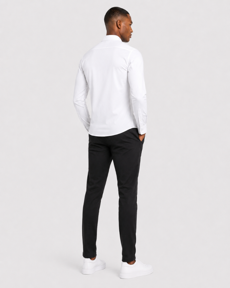 By Alden white slim-fit dress shirt on male model, back view, full body, light gray background. #color_white