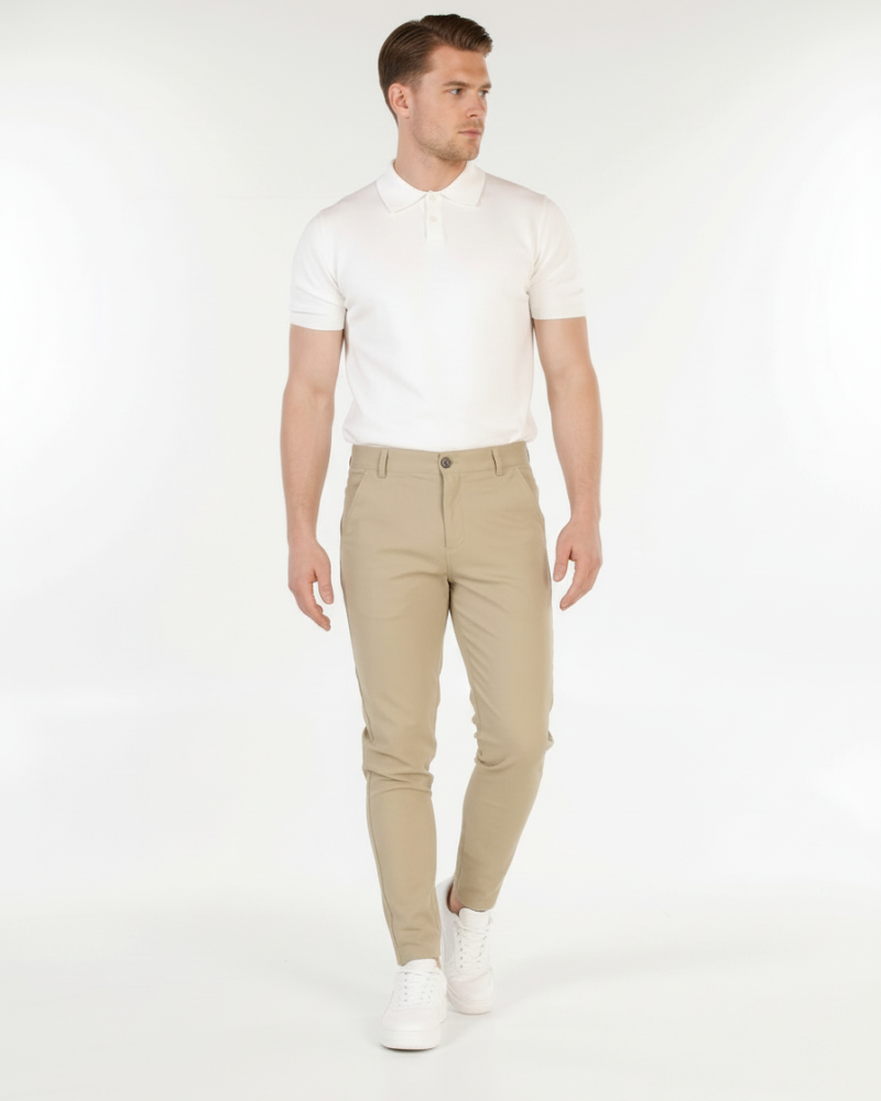 Minimalist luxury beige cotton-stretch chinos in a slim fit, featuring a smooth, breathable finish for a refined look.