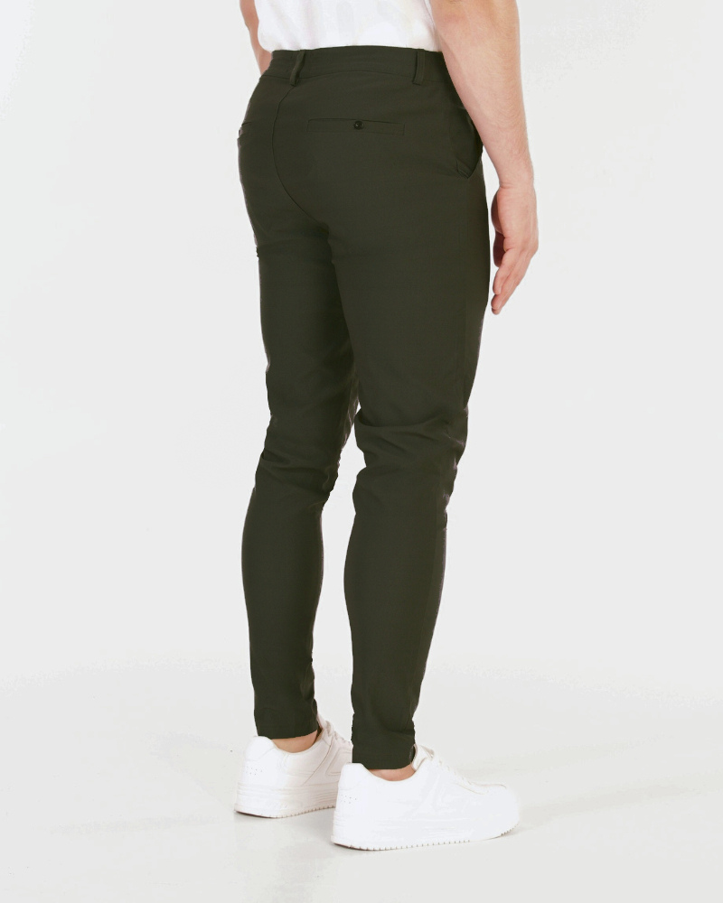 Rear view of luxury olive chinos in breathable stretch material featuring a minimalist clean-lined pocket design.