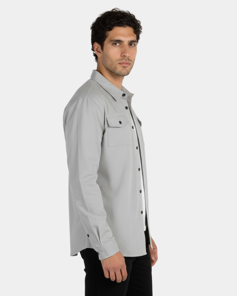 Minimalist luxury stone twill overshirt shown in a side profile, featuring a structured fit and premium textured fabric.
