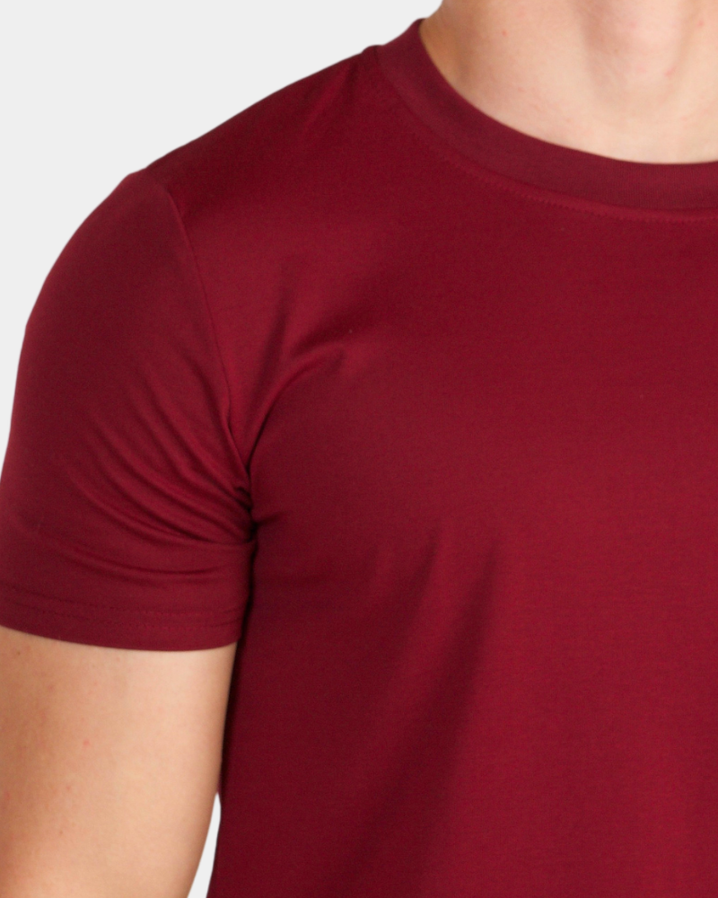 Macro view of burgundy luxury pima cotton Smart Fit T-shirt highlighting the premium finish and fabric density.
