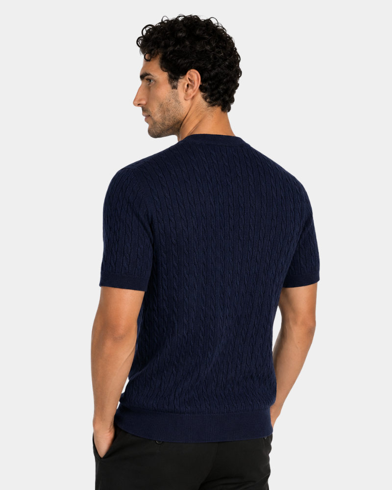 Man wearing a By Alden navy blue cable knit sweater on a white background #color_navy