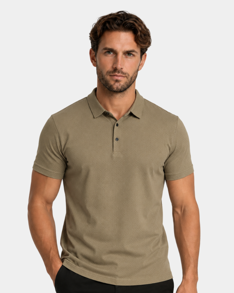 Man wearing a By Alden beige polo shirt against a plain background #Color_camel