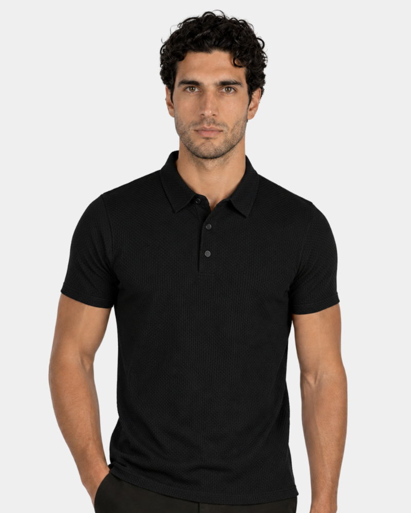 Man wearing a By Alden black polo shirt against a plain background #Color_black