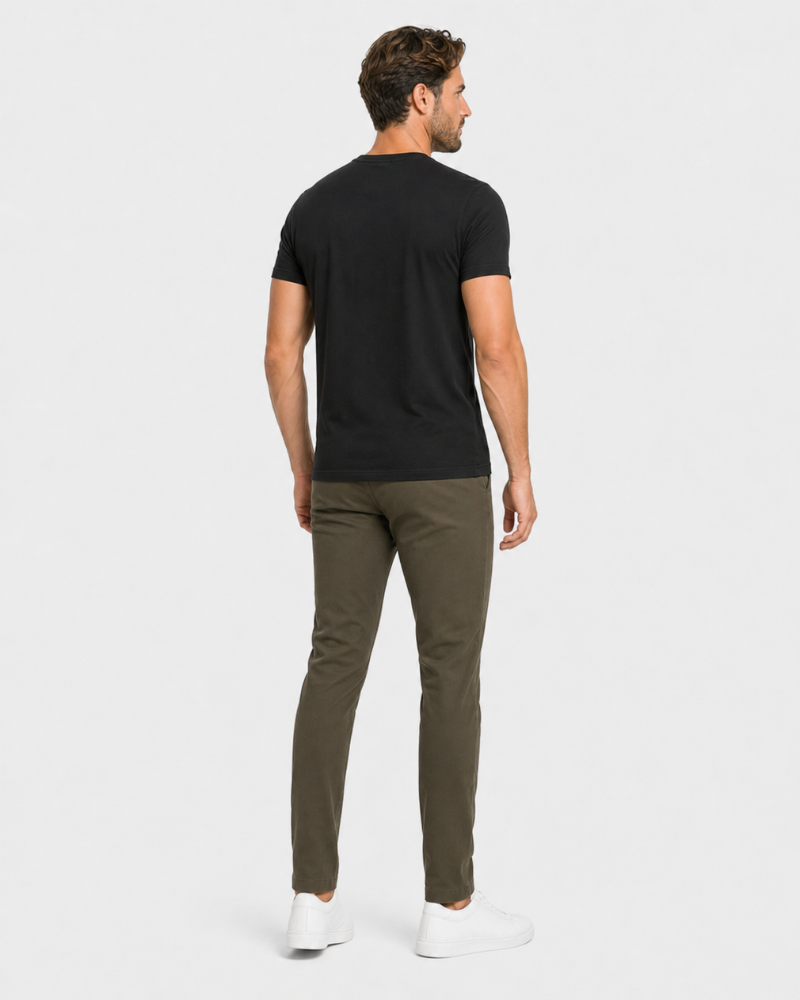 Man wearing a By Alden black t-shirt and green pants on a white background #Color_olive green