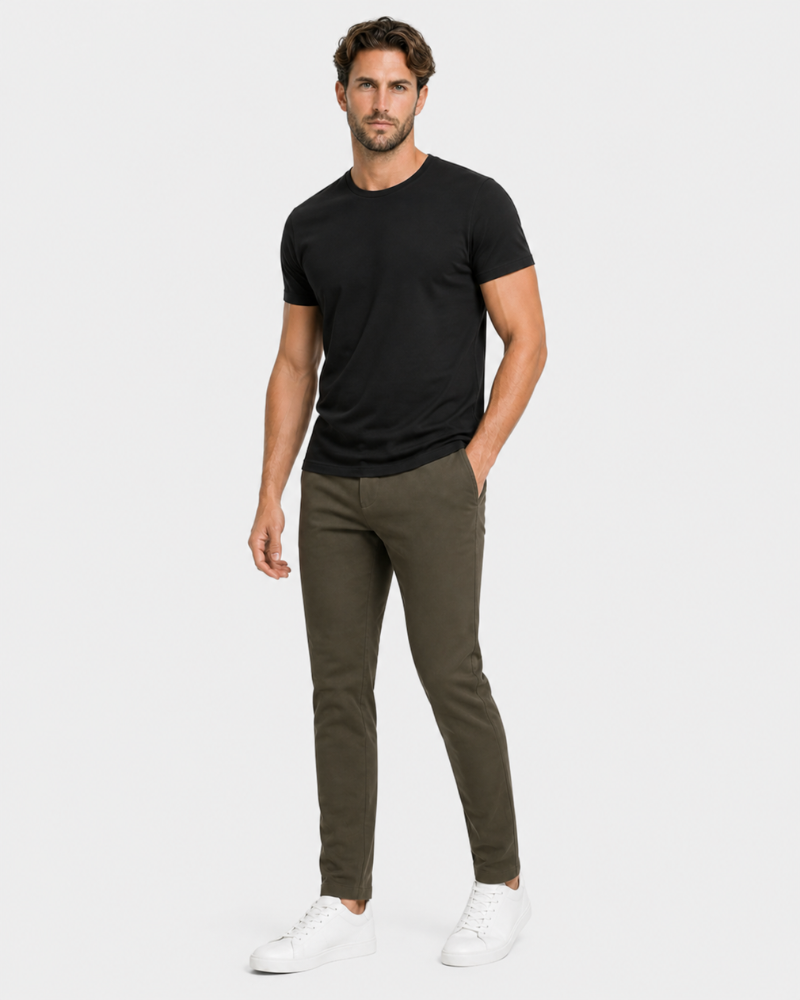 Man wearing a By Alden black t-shirt and olive green pants on a white background #Color_olive green
