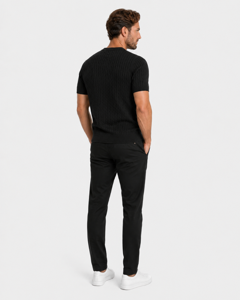 Man wearing a By Alden black t-shirt and pants on a white background #color_black