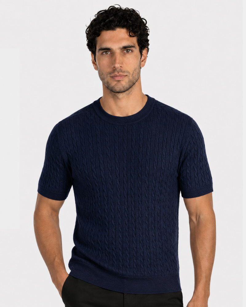 Man wearing a By Alden navy blue cable knit sweater on a white background #color_navy