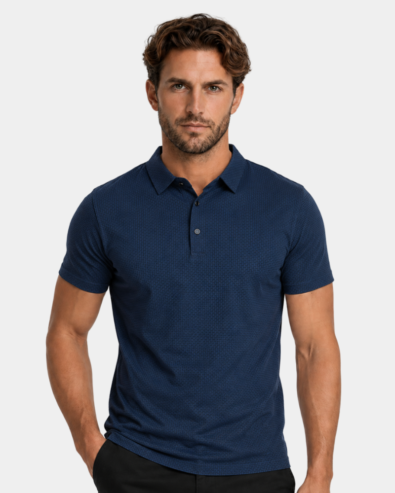 Man wearing a By Alden navy blue polo shirt against a plain background #Color_blue