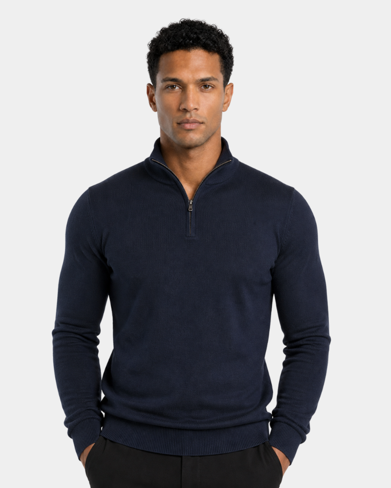 Man wearing a By Alden navy blue quarter-zip sweater on a light gray background #color_navy