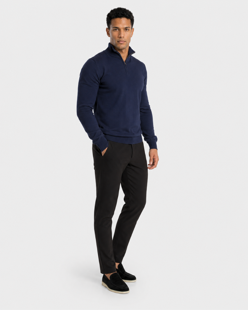 Man wearing a By Alden navy sweater and black pants on a white background #color_navy