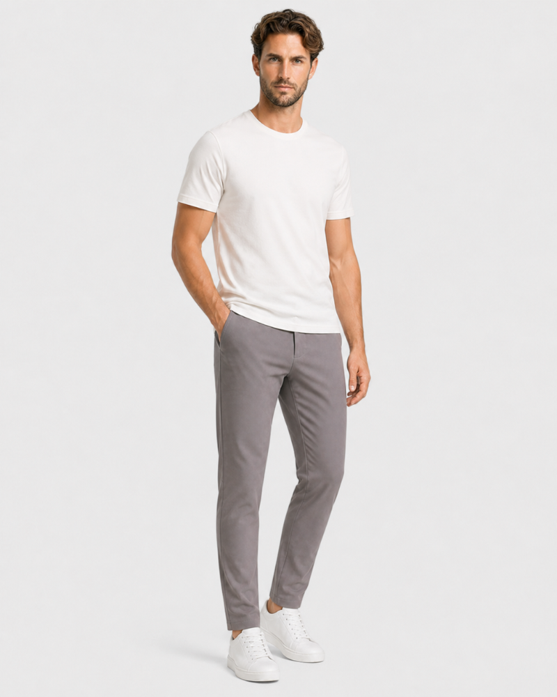 Man wearing a By Alden white t-shirt and gray pants on a plain background #Color_gray