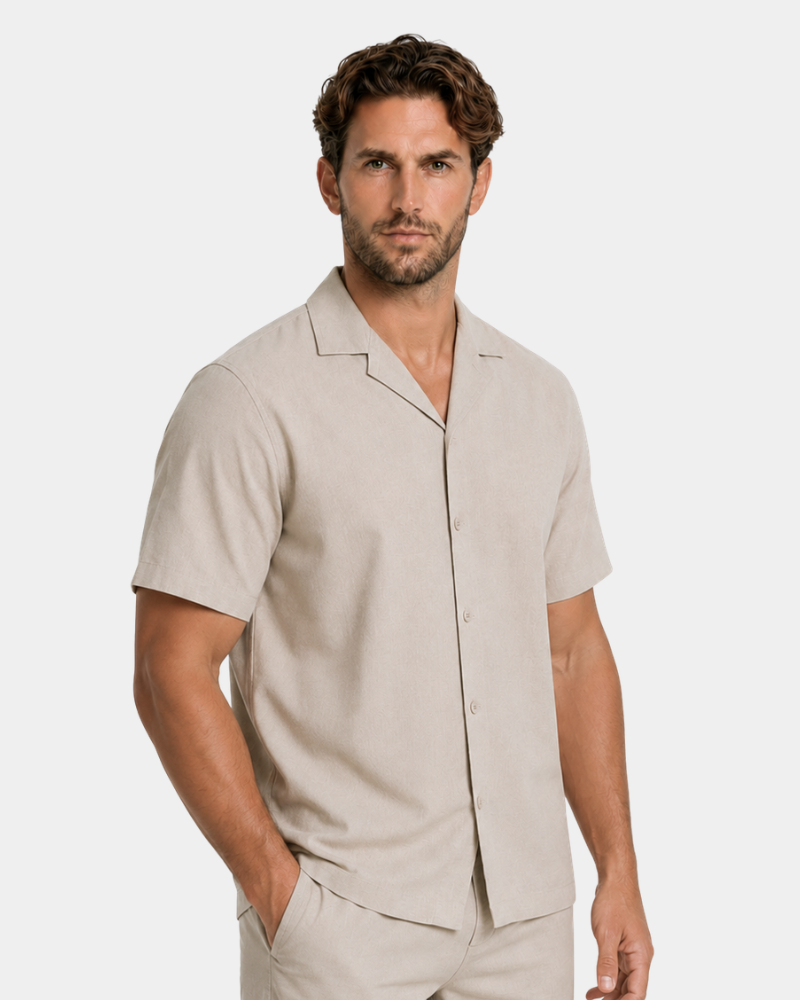 By Alden Sand Linen Camp Collar Shirt worn by a White male model, cropped front angle view, light grey background #Color_deep stone
