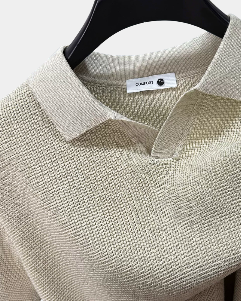 By Alden cream open-collar knit polo shirt collar and label detail, hanger, close-up, light gray background.
#color_off white