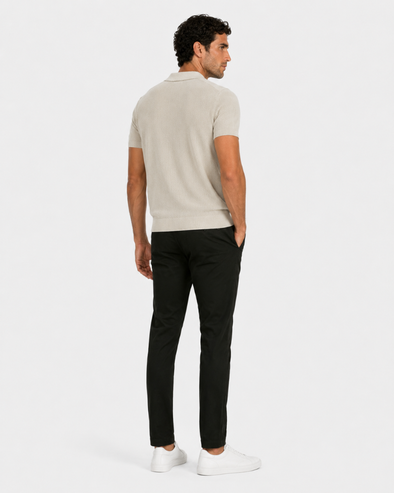 By Alden cream open-collar knit polo shirt on male model, back view, full body, light gray background. #color_off white