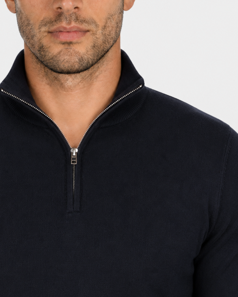 By Alden navy blue half-zip knit sweater zipper detail, male model, front close-up, light gray background. #Color_black