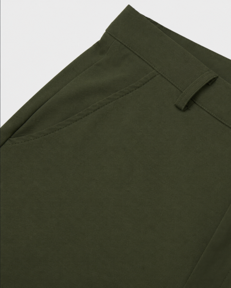 By Alden olive green chino trousers waistband and pocket detail, flat lay, close-up, light gray background. #color_olive green