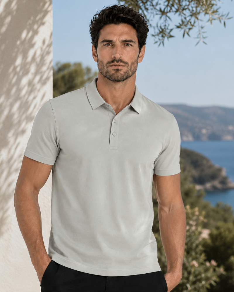 By Alden stone knit polo shirt on male model, front view, upper body, outdoor blue sea background. #color_stone