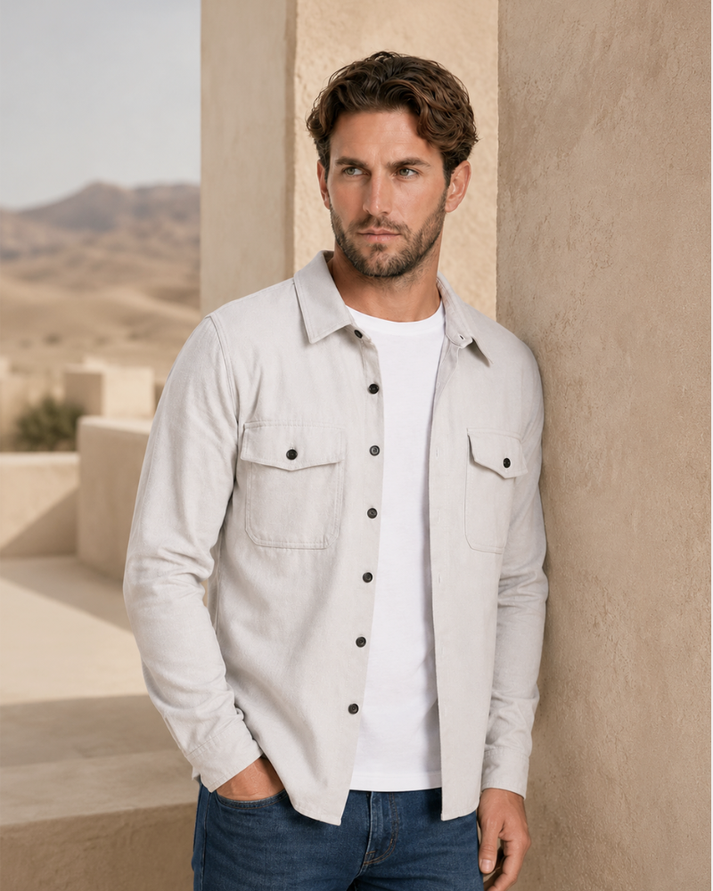 By Alden stone overshirt on male model, three-quarter view, upper body, outdoor desert beige background. #Color_gray