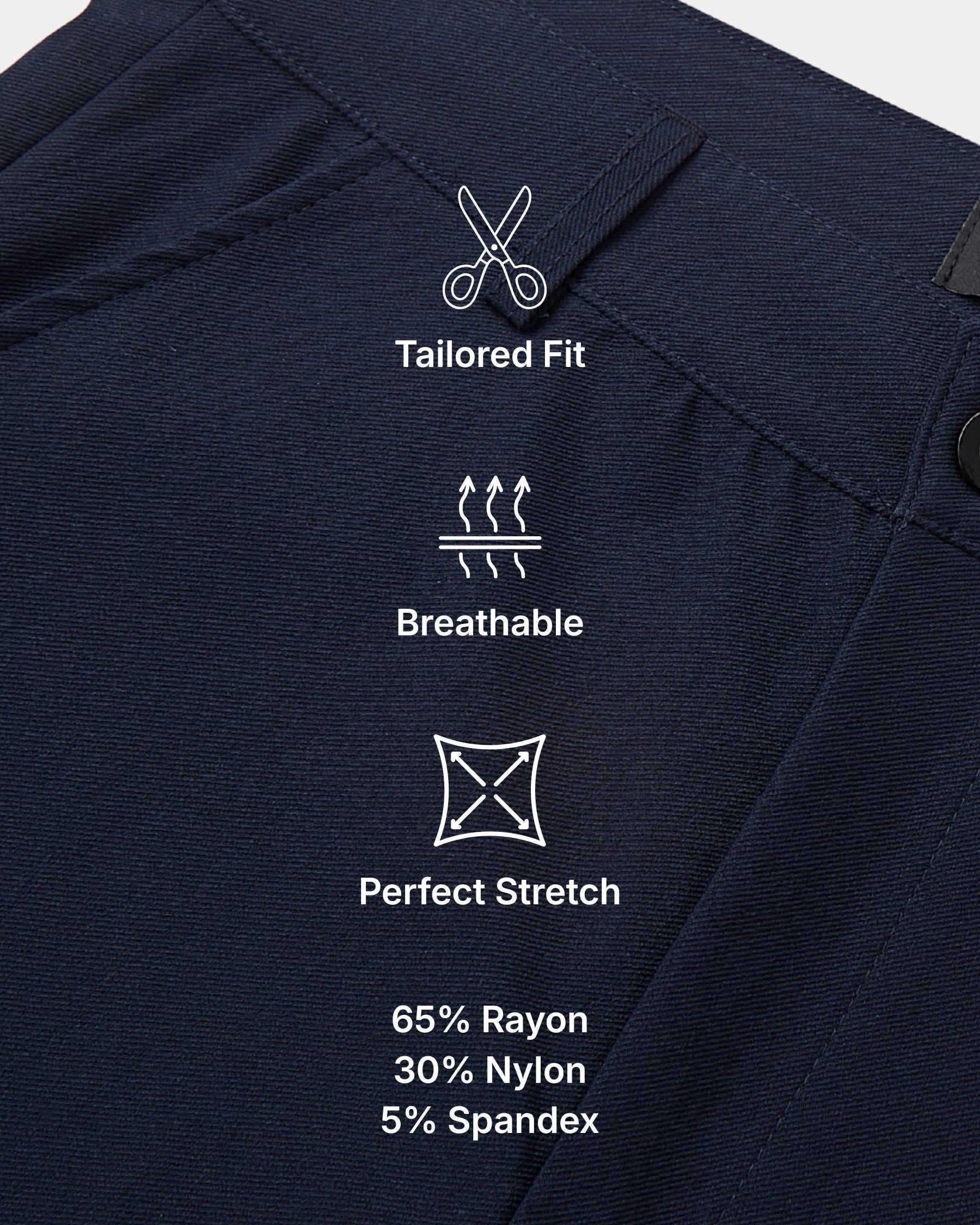 Close-up of dark navy fabric with white printed icons and text highlighting features: Tailored Fit, Breathable, and Perfect Stretch, plus material percentages 65% Rayon, 30% Nylon, 5% Spandex.