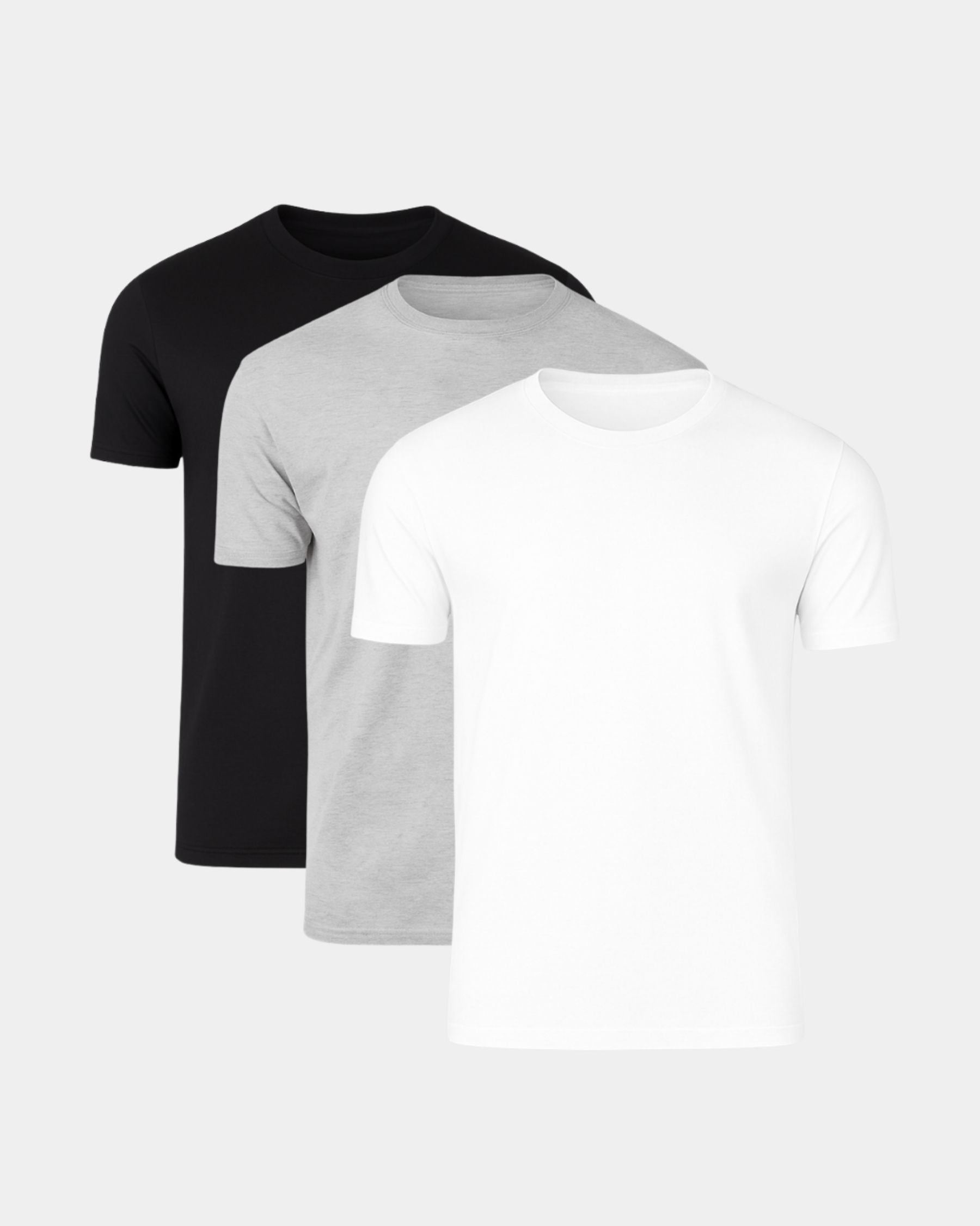 Three short-sleeve crew-neck t-shirts in black, light gray, and white, arranged in a layered stack on a light gray background.